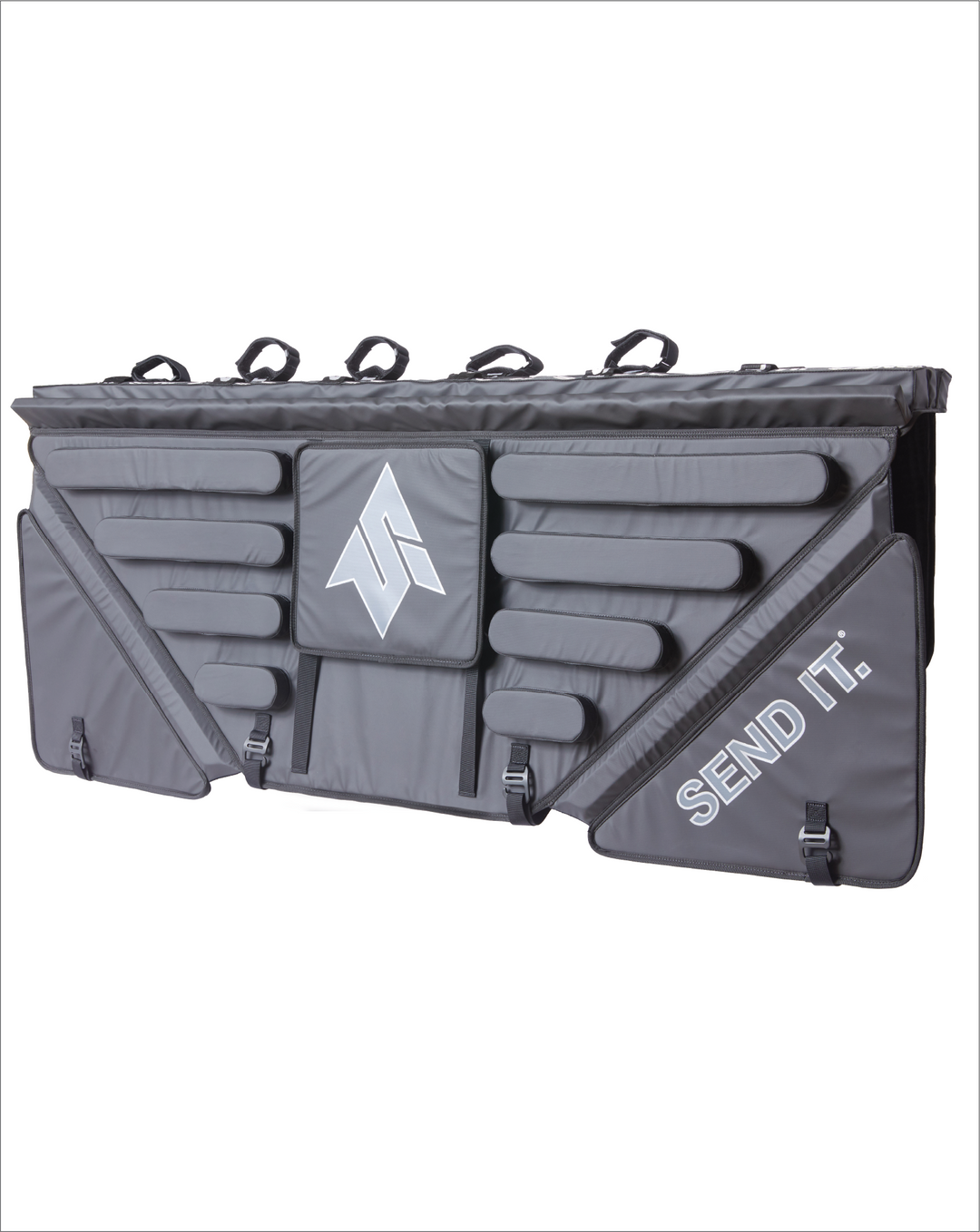 Image of the Mid Size Send It High Roller Tailgate Pad. Shows the pad from the front and at angle as if the tailgate pad was installed on a truck with inside of the tailgate pad showing. The truck tailgate bike pad has a sliding window, heavy duty padding, and 5 straps to secure your bikes.