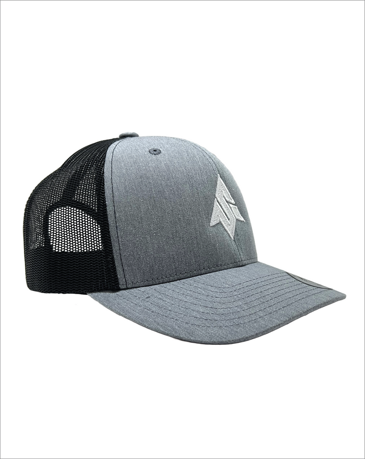 Image from the side of the Send It Icon trucker hat classic style in heather grey with embroidered logo on the front and the send it phrase embroidered on the mesh. Yupoong authentic classic snap back style. 