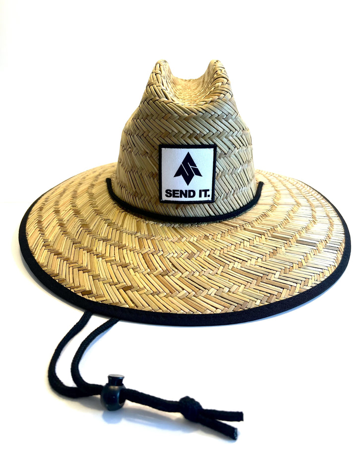 Image of the Send It Straw hat for summer shade. The Straw hat features the inconic send it logo on a patch affixed to the front of the hat.