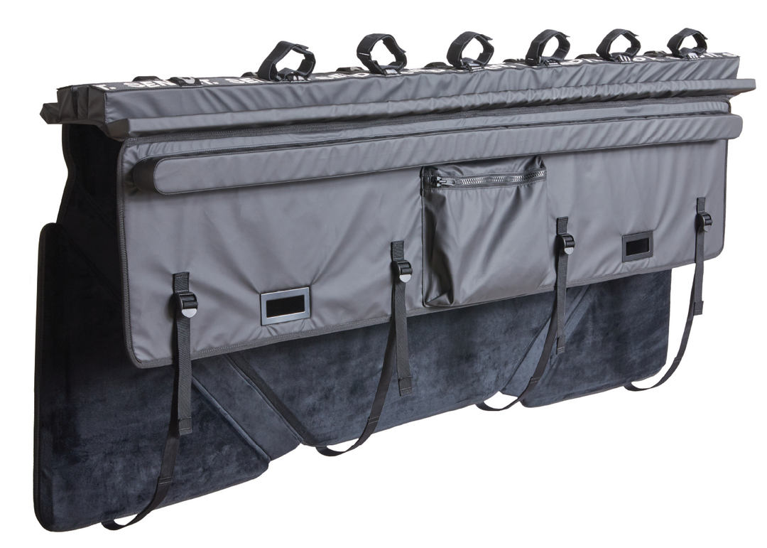 Image of the full size Send It High Roller Tailgate Pad. Shows the pad from the inside and at angle as if the tailgate pad was installed on a truck with inside of the tailgate pad showing. The full size truck tailgate bike pad has a sliding window, heavy duty padding, and 6 straps to secure your bikes.